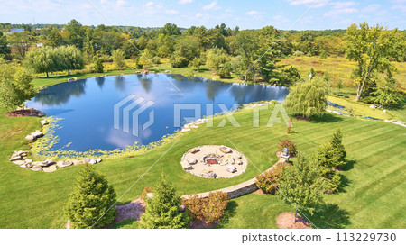 Aerial View of Serene Pond, Fire Pit, and Lush Garden in Leo, Indiana 113229730