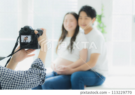 A husband supporting a pregnant woman 113229770