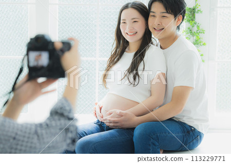 A husband supporting a pregnant woman 113229771