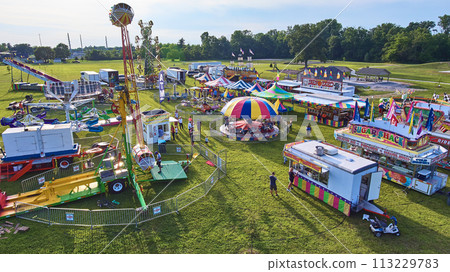 Aerial View of Festive Fairground with Amusement Rides and Food Stalls 113229783