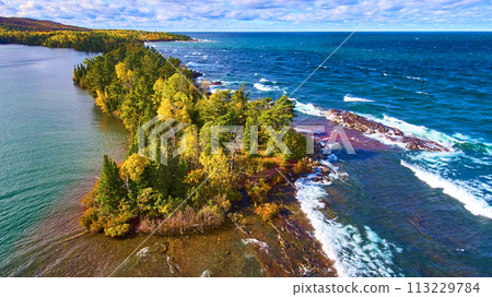 Aerial View of Coastal Forest Peninsula and Waves in Lake Superior Aerial View of Coastal Forest Peninsula and Waves in Lake Superior 113229784