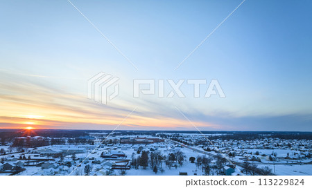 Aerial Winter Sunrise Over Snowy Suburban Neighborhood Aerial Winter Sunrise Over Snowy Suburban Neighborhood 113229824