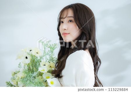 Woman with a bouquet Woman with a bouquet 113229884