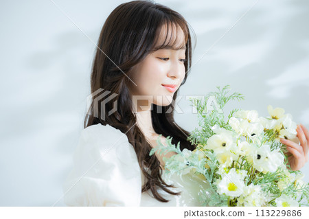 Woman with a bouquet 113229886