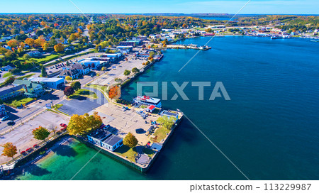 Aerial Autumn Lakeside Town with Boat Dock in Michigan Aerial Autumn Lakeside Town with Boat Dock in Michigan 113229987