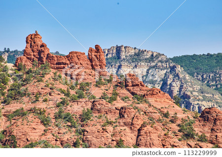 Sedona Red Rock Formations with Green Vegetation under Blue Sky Sedona Red Rock Formations with Green Vegetation under Blue Sky 113229999
