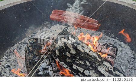 Rustic Outdoor Fire Pit Cooking with Roasting Hot Dogs Rustic Outdoor Fire Pit Cooking with Roasting Hot Dogs 113230136