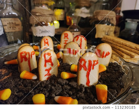 Halloween Graveyard Dessert Setup with Candy Corn Treats 113230185