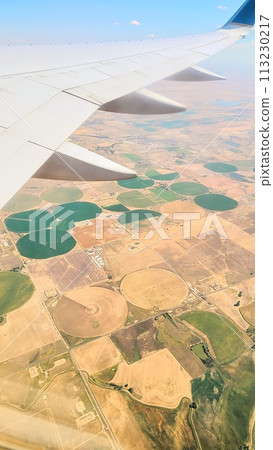 Aerial View of Patchwork Farmland and Airplane Wing Aerial View of Patchwork Farmland and Airplane Wing 113230217