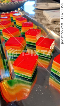 Rainbow Layered Jelly Desserts on Metal Tray, Shallow Depth of Field Rainbow Layered Jelly Desserts on Metal Tray, Shallow Depth of Field 113230358