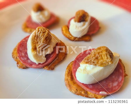 Gourmet Appetizer with Cheese and Dried Fruit, Elevated View Gourmet Appetizer with Cheese and Dried Fruit, Elevated View 113230361