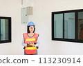 Asian women home Inspector surveyor wearing vests and hard hat at new property 113230914