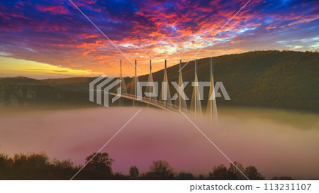 Beautiful scenery of Millau Bridge and the morning glow under the sea of clouds Beautiful scenery of Millau Bridge and the morning glow under the sea of clouds 113231107