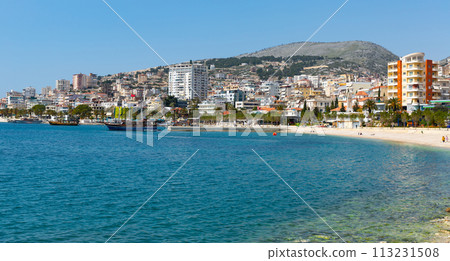 Cityscape of Sarande on shore of blue bay of Ionian Sea Cityscape of Sarande on shore of blue bay of Ionian Sea 113231508