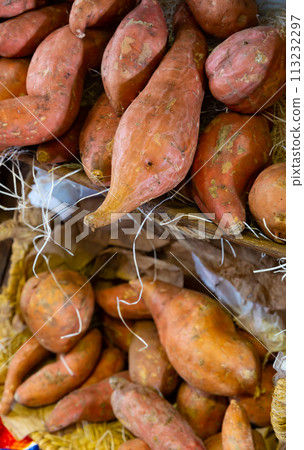 Raw sweet potato in basket in greengrocery 113232297