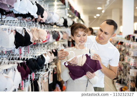 Couple man and woman choosing bra in store 113232327