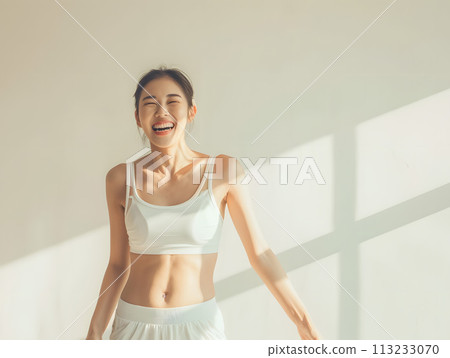 Positive Asian woman with energetic smile 113233070