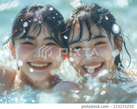 Youthful smiling Asian woman bathed in summer sunshine 113233250