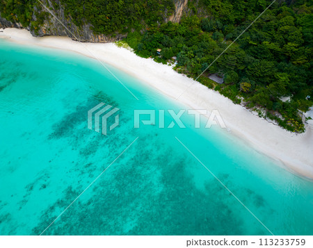 Aerial view of a tropical Maya bay beach with turquoise water and white sand Aerial view of a tropical Maya bay beach with turquoise water and white sand 113233759