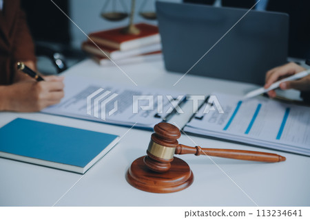 Businessman and lawyer discuss the contract document. Treaty of the law. Sign a contract business. 113234641
