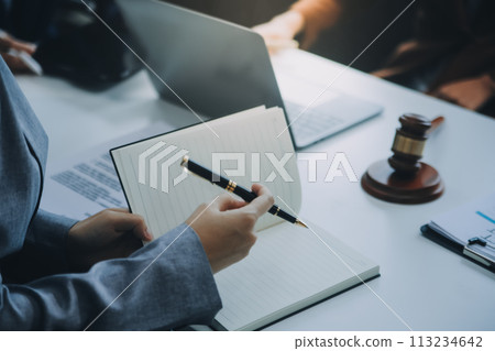 Businessman and lawyer discuss the contract document. Treaty of the law. Sign a contract business. Businessman and lawyer discuss the contract document. Treaty of the law. Sign a contract business. 113234642