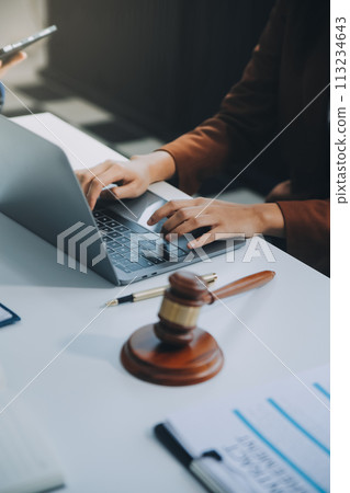 Businessman and lawyer discuss the contract document. Treaty of the law. Sign a contract business. Businessman and lawyer discuss the contract document. Treaty of the law. Sign a contract business. 113234643