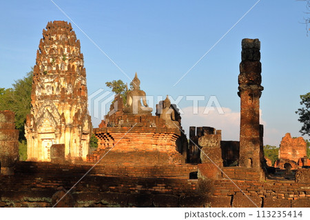 Pagodas and Buddhist statues at Wat Phra Pa Iluang ruins in Sukhothai Historical Park, a world cultural heritage site in Sukhothai, the ancient capital of northern Thailand 113235414