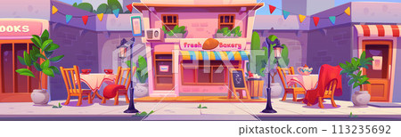 Bakery facade exterior with tables and chairs. 113235692