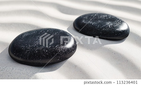 白沙和兩塊黑色和圓形石頭的背景 113236401