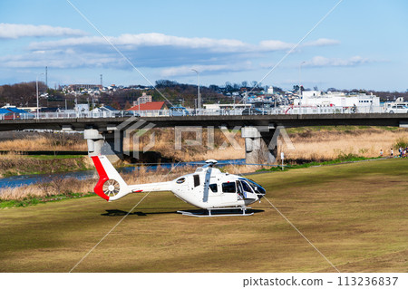 Helicopter landed on riverbed for emergency transport Helicopter landed on riverbed for emergency transport 113236837