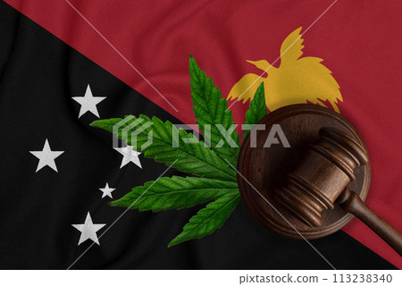 Gavel and hemp leaf on the Papua New Guinea flag background. The concept of legalization of marijuana in Papua New Guinea 113238340