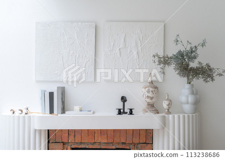 White minimalist loft interior with fireplace, mock up picture frame and minimalist home decor. Real photo template. 113238686