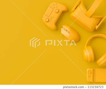 Modern home office setup featuring keyboard, gaming controllers and headphones Modern home office setup featuring keyboard, gaming controllers and headphones 113238723