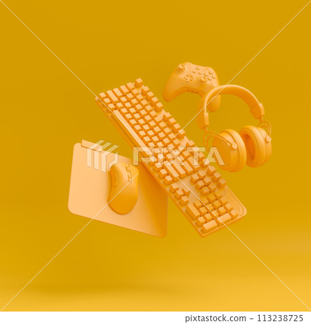 Modern home office setup featuring keyboard, gaming controllers and headphones Modern home office setup featuring keyboard, gaming controllers and headphones 113238725