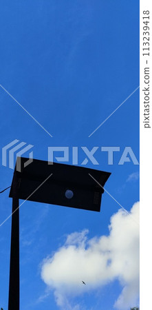 Beautiful view over the blue sky with white clouds 113239418