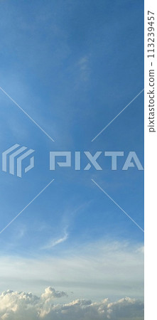 Beautiful view over the blue sky with white clouds Beautiful view over the blue sky with white clouds 113239457