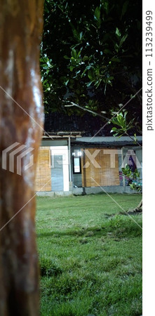 View of the house at night from outside the building 113239499