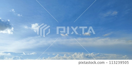 Beautiful view over the blue sky with white clouds 113239505