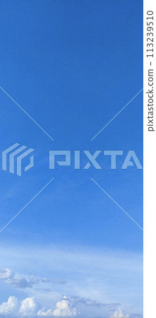 Beautiful view over the blue sky with white clouds 113239510