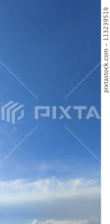 Beautiful view over the blue sky with white clouds Beautiful view over the blue sky with white clouds 113239519