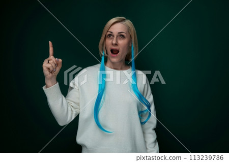 Woman With Long Blue Hair Pointing at Camera 113239786