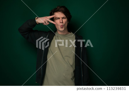 Man Making Silly Face With Fingers Man Making Silly Face With Fingers 113239831