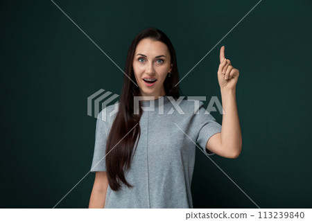 Woman Pointing at Something With Her Finger 113239840