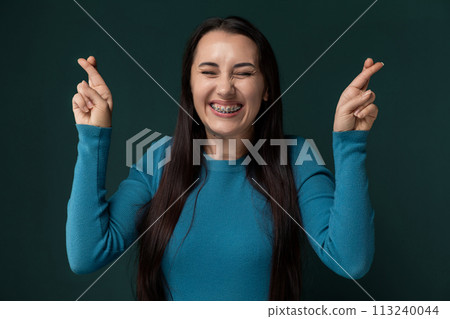 Woman in Blue Shirt Holding Hands Up Woman in Blue Shirt Holding Hands Up 113240044