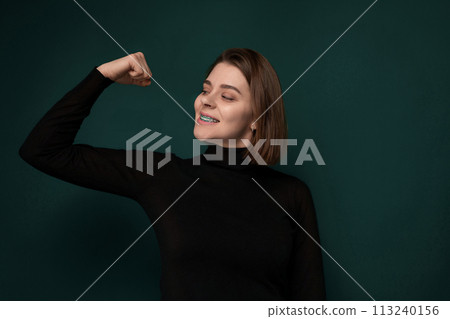 Woman in Black Shirt Poses for Picture Woman in Black Shirt Poses for Picture 113240156