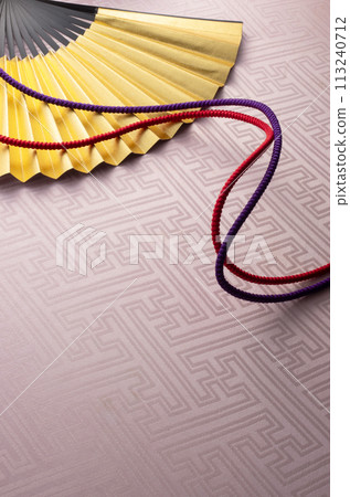 Japanese style image of golden fan and braid Japanese style image of golden fan and braid 113240712