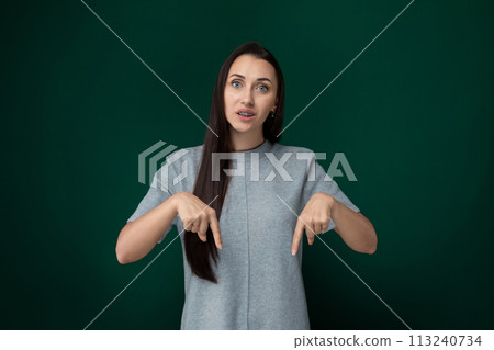 Woman With Long Hair Pointing at Something 113240734