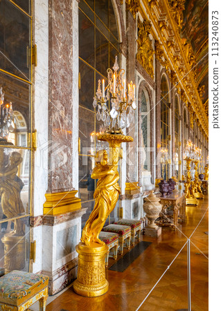 Hall of Mirrors. Decorated interior with historical furniture and architectural details of Chateau Versailles near Paris, France Hall of Mirrors. Decorated interior with historical furniture and architectural details of Chateau Versailles near Paris, France 113240873