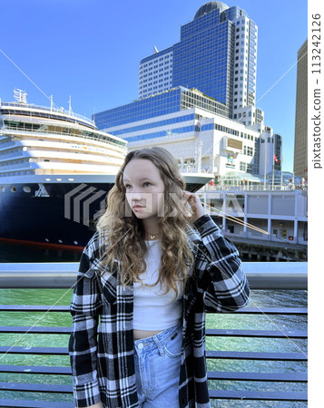 Education in Canada Universities and Colleges A girl stands in front of Canada Place Vancouver Downtown As well as travel and trips on a cruise ship, a huge ship stands in the background 113242126
