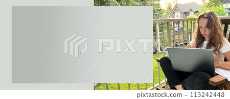 Online learning fair-haired european girl sits on her knees with a laptop on the street on the balcony or watches a lesson. Near her hand are printouts of sheets on which she will do the task. 113242448